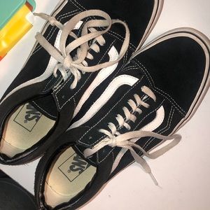 Black and white low top vans
